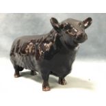 A black glazed Beswick bull, the model with gilt printed mark - approved by The Aberdeen Angus