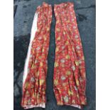 A pair of lined linen curtains printed with birds and flowers on red ground. (111in) (2)