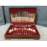 A walnut cased canteen of silver plated cutlery by AE Poston & Co, eight settings including