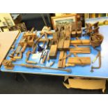A collection of antique woodworking tools - planes, clamps, vices, a saw, a spokeshave, callipers,