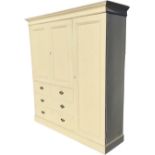 A Victorian painted pine combination wardrobe with moulded cornice above panelled cupboards with