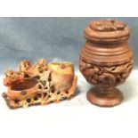 An eastern carved hardwood tobacco jar & cover with entwined dragons framed by bamboo bands; and a