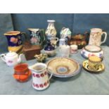 Miscellaneous ceramics including two Victorian majolica jugs, a copper lustre teapot, vases, a