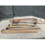 Six miscellaneous riding crops - one Swaine, one horn handled, leather, etc; four walking canes -