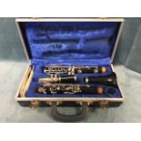A cased Boosey & Hawkes clarinet, the English made Regent model no 440316, complete with spare reeds