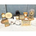 Miscellaneous clocks including a Gustav Becker anniversary brass clock, a 50s mantleclock, alarm