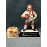 A Carlton Ware breweriana figure - Pick Flowers Brewmaster; and a Clarice Cliff ribbed pot painted