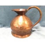 A Victorian copper harvest jug, the shaped spout & rim with soldered assay prunt, having riveted