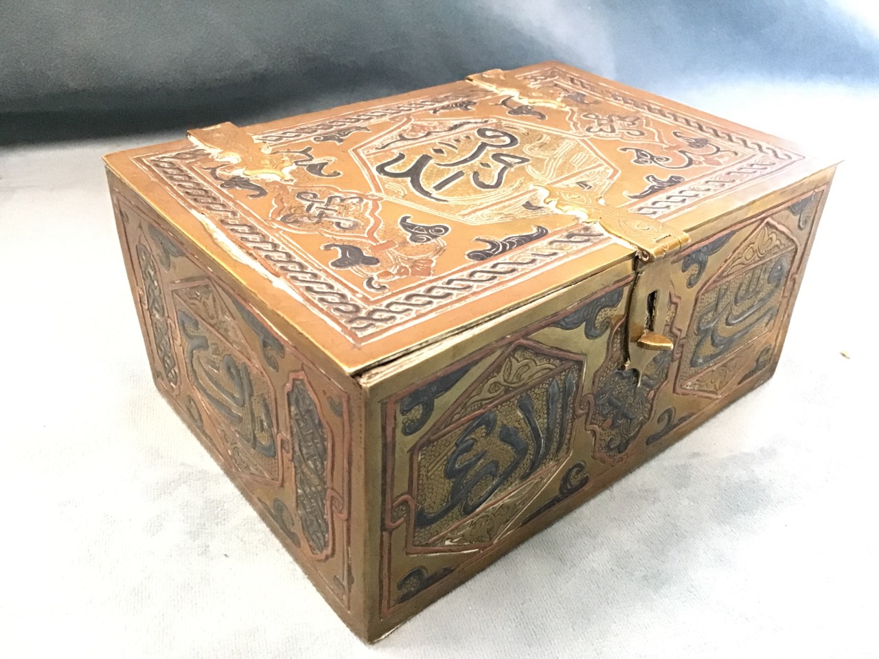 An eastern brass casket with Islamic decoration in copper and pewter to panels, the interior with - Image 2 of 3