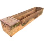A rectangular 6ft cast iron trough with water supply compartment to one end. (72in)