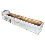 An 8ft galvanised water trough with tubular rim, having water supply compartment to one end. (95.5in