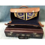 A leather cased pair of masonic cuffs with gilt thread embroidered decoration; and an unused leather