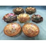 Seven carnival glass bowls - scalloped, floral & fruit embossed, basket type, a pair with