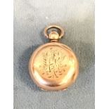 A Victorian yellow metal coin case of hinged bun form, the interior with sprung panel decorated with