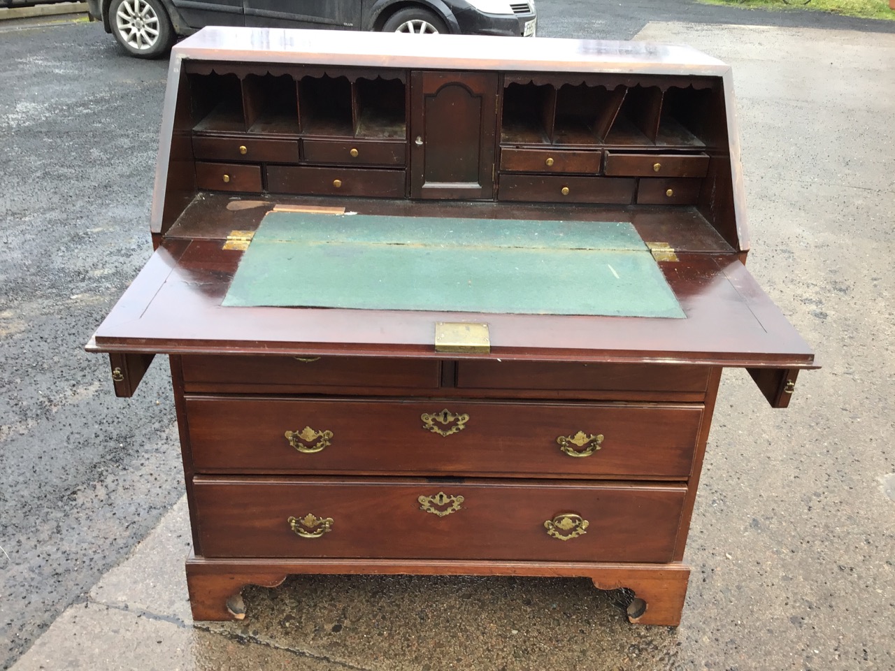 A George III mahogany bureau with cleated fallfront enclosing a fitted interior with drawers and - Image 2 of 3