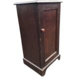A stained late Victorian pot cupboard with moulded top above a panelled door, raised on bracket