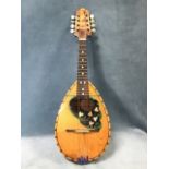 An Italian eight string mandolin, the cedar body with chequered purfling inlaid with mother-of-pearl