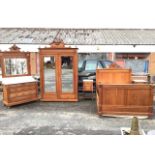 A French oak bedroom suite with twin mirror door wardrobe, marble topped dressing table with