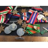 A miscellaneous box of medals - ribbons, Orange Free State bar, buttons, general service medals -