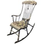 An unusual nineteenth century rocking chair in original painted finish with ribbon scrolling on