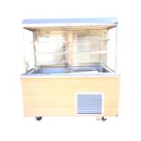 A Coolcheck/Stellex refrigerated counter, the illuminated top with adjustable shelves, glass sides