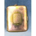 A 9ct gold cigarette case with rounded shaped hinged covers, mounted with presentation panel dated