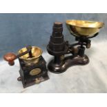 A Victorian cast iron coffee grinder by Baldwin Son & Co, having brass mounts and hardwood turning
