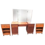 A deco style mahogany dressing table and a pair of beside cabinets, the back with rectangular