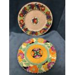 A Maling brightly decorated rack plate with orange, yellow and red flowers on black & primrose