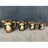 A graduated set of four Copeland stoneware 1897 commemorative jugs, with applied sprigwork