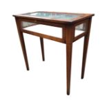 A rectangular mahogany bijouterie table, the glazed top with satinwood banding and overall boxwood