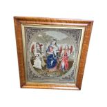 A Victorian maple framed needlework panel, the cushion moulded frame with gilt slip framing tapestry