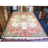 A fine Belgian carpet woven in the classical Brussels architectural style having central floral
