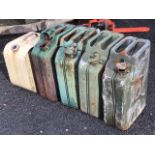 Four old 20L jerry cans, two dated 1944 & 1976; and another square panelled fuel can. (5)