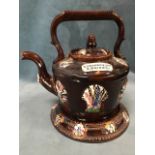 A Victorian bargeware teapot & cover on stand with applied floral shell sprigwork decoration to