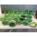A collection of antique green leaf moulded plates - various patterns, serving dishes, sets, some