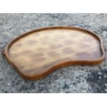A Thomson of Kilburn (Mousey) kidney shaped oak tray, the piece carved out of the solid with two