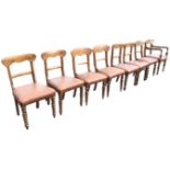A set of eight married Victorian bar-back dining chairs with stuffover upholstered studded seats