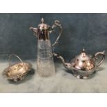 A Victorian glass claret jug with silver plated mounts, the star cut base beneath hobnail panels