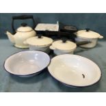 A set of three cast iron Le Creuset pans & covers; two enamelled tin bowls; a set of cast iron