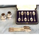 A cased hallmarked set of silver coffee spoons - London, 1923; a set of six silver teaspoons -