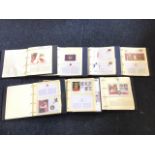 A set of seven royal commemorative albums of coins and first day covers, celebrating birthdays,