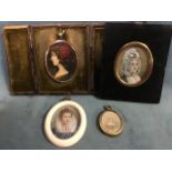 Four oval nineteenth century or earlier miniatures - French style lady with hair scarf in gilt metal