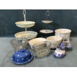 Kitchenalia - two three-tier cake stands, five jelly moulds, a blue glazed spotted TG Green