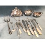 Nine pieces of hallmarked silver - a Birmingham 1912 boat shaped mustard and salt, a mother-of-pearl
