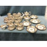 A Victorian twelve-piece Coalport tea & coffee service decorated with cream panels framed by