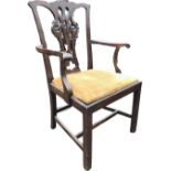 A Chippendale style mahogany armchair with shaped back rail above pierced splat, the splayed