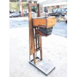 A photographic enlarger with mahogany case rising & falling with crank handle on oak stand, the