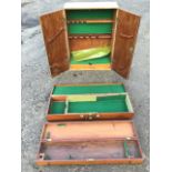 A fitted two-door tool cupboard with baize lining; a rectangular baize lined mahogany box having