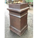 A square salt glazed tapering stoneware chimney pot with moulded bands and plinth. (12.75in x 23.